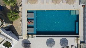 an overhead view of a large swimming pool at Alexandros Mykonos in Klouvas