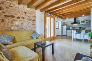 a living room with a couch and a table at Finca Barralina in Campos +29 photos