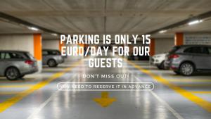 a parking garage with cars parked in it at The Amberlyn Suite Hotel in Budapest