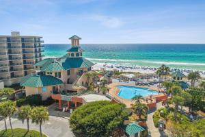 an aerial view of a resort with a pool and the ocean at Luau at Sandestin Tower I & II in Destin