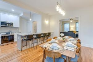 a kitchen and living room with a table and chairs at Richmond Home with Patio Walk to Byrd Park! in Richmond