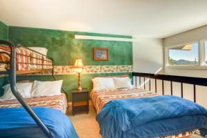 a bedroom with two beds in a room at Cozy Condo with Balcony - Near Big Sky Resort! in Big Sky