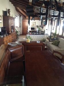 a living room with a couch and a table at Bed & Breakfast Ca' di Vissai in Arnasco