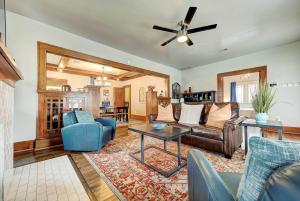 a living room with a couch and a table at Classen Craftsman-near Asian & Paseo district in Oklahoma City