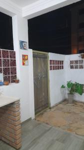 a room with a door in the side of a house at Chalés Manacá da Serra in Ubatuba