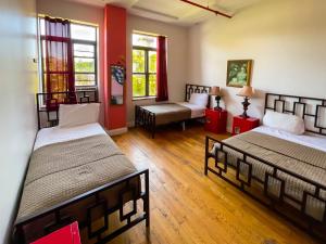 Postel nebo postele na pokoji v ubytování NY Moore Hostel