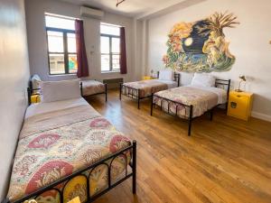 Postel nebo postele na pokoji v ubytování NY Moore Hostel