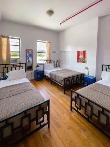 Postel nebo postele na pokoji v ubytování NY Moore Hostel