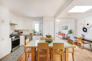 a kitchen and dining room with a table and chairs at 3 BR 1 Bath Prime Williamsburg in Brooklyn