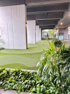 a courtyard with a golf course in a building at Grand Residence Suite At Opus Kuala Lumpur in Kuala Lumpur