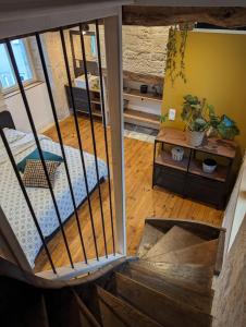 an overhead view of a room with a bed and a table at Maison de Bourg Cressensac in Cressensac