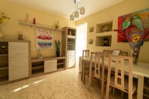 a dining room with a table and chairs at Casa rural El Tejar de Algar / 1262 in Algar