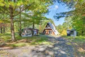 a home in the woods with a barn at Private Pocono Getaway with Hot Tub and Sauna! in East Stroudsburg