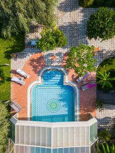 an overhead view of a swimming pool in a garden at Villa Rita Taormina in Taormina