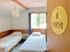 Postel nebo postele na pokoji v ubytování Moment Chalet Hakuba
