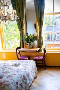 Postel nebo postele na pokoji v ubytování Boutique Hotel Museumkwartier