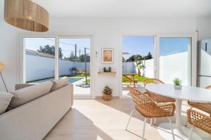 a living room with a couch and a table at Villa Morales in Chiclana de la Frontera