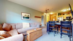 a living room with a couch and a table at Sunstone #206 Condo in Mammoth Lakes