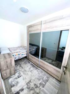 a bedroom with a bed and a large mirror at One bedroom appartement with wifi at Anderlecht in Brussels