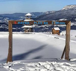 a sign on the top of a snow covered mountain at Apartman ALEA in Pale