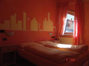 Giường trong phòng chung tại Casa Martina