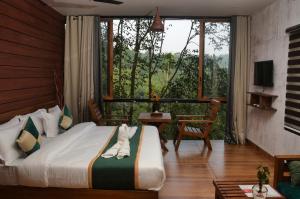 Katil atau katil-katil dalam bilik di TREE6 WAYANAD