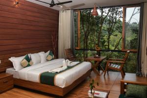 Katil atau katil-katil dalam bilik di TREE6 WAYANAD