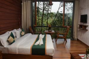 Katil atau katil-katil dalam bilik di TREE6 WAYANAD