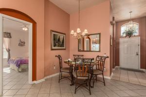 a dining room with a table and chairs at 2217 Wyndham Palms in Kissimmee