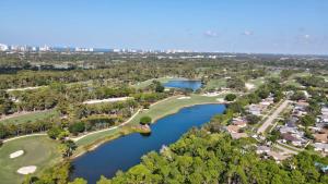 an aerial view of a golf course and a lake at Bungalow Close to Naples Beaches in Naples