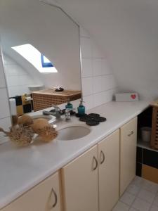 a bathroom counter with a sink and a mirror at HONES - RELAX HOUSE in Perissa +46 photos