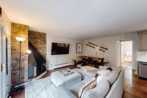 a living room with a couch and a fireplace at Vail East Unit 7 in Vail