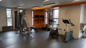 a gym with several treadmills and exercise bikes at VN Turiassu II in Sao Paulo
