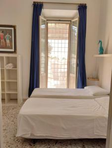Posteľ alebo postele v izbe v ubytovaní Santa Marinella Appartamento centralissimo a 2 passi dal mare