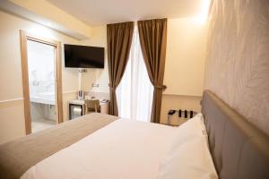 Hotel Maximus客房内的一张或多张床位