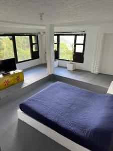 Postel nebo postele na pokoji v ubytování Jaragual EcoHostel