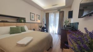 a bedroom with a bed with a towel on it at Retiro Studio in Madrid