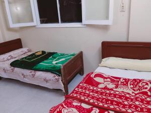 Een bed of bedden in een kamer bij Villa Elaraby Mohamed