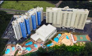 an aerial view of a building with a resort at Golden Dolphin Grand Hotel in Caldas Novas