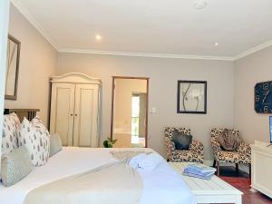 Amoris Guesthouse In Waterkloof Ridge客房内的一张或多张床位