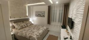 Voodi või voodid majutusasutuse GOLD APARTMANI toas