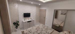 Voodi või voodid majutusasutuse GOLD APARTMANI toas