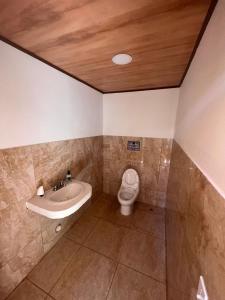 a bathroom with a sink and a toilet at Casa de la playa in Santa Catalina