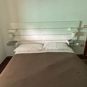 Posteľ alebo postele v izbe v ubytovaní Alloggio in Centro Città con Parcheggio Privato e WIFI