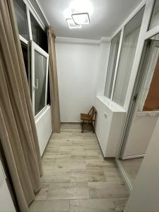 an empty room with a hallway with windows at Crang Luxury View in Buzău