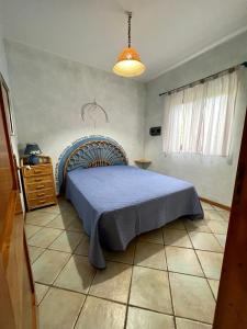Tempat tidur dalam kamar di Casa Mariella - Borgo San Basilio