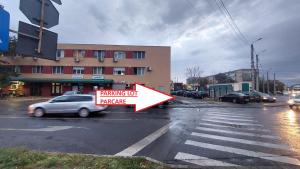 a sign on a street with a parking lot variance at Cristina's place Arad in Arad
