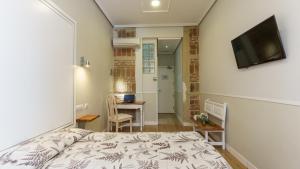 Voodi või voodid majutusasutuse Hostal Madrid toas