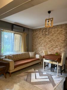 a living room with a couch and a table at Araz Apart in Bursa