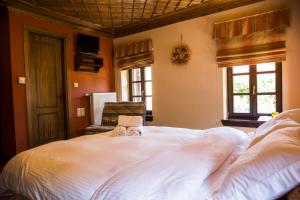 En eller flere senge i et værelse på Ελευθερία + 9 billeder